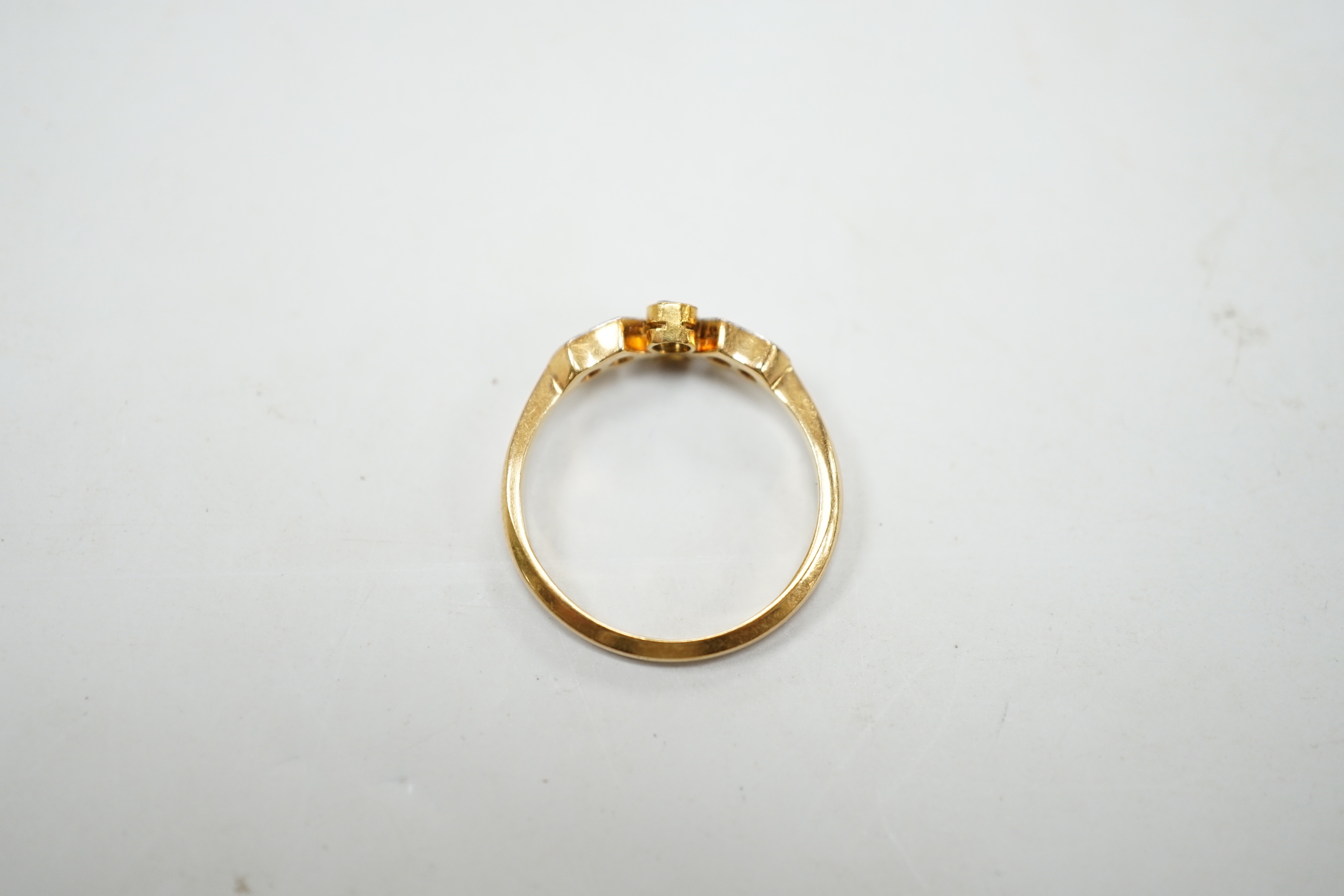 A 1920's 18ct, plat and six stone diamond chip set cluster ring, size M, gross weight 2.5 grams.